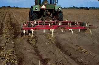 Listing of sandy soil reduces wind erosion.